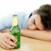 teen with beer and head down on table