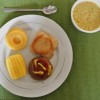 Figure 3. Beef burger with bun (both puréed ), topped with ketchup and mustard, served with shaped purées of corn and sliced pineapple as side dishes, and coconut custard for dessert