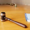 Gavel on table with notepad