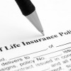 pen filling out life insurance form