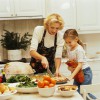 portrait of a young woman and her daughter (10-12) preparing a thanksgiving meal