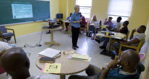 Duval County Extension Agent Anita McKinney teaches a "Smart Money" course at the Jacksonville City Rescue Mission in Jacksonville, Florida.